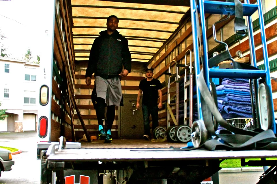 On The Go Moving team with a branded moving truck